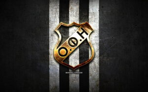 HD-wallpaper-ofi-crete-fc-golden-logo-super-league-greece-black-metal-background-football-ofi-crete-greek-football-club-ofi-crete-logo-soccer-greece